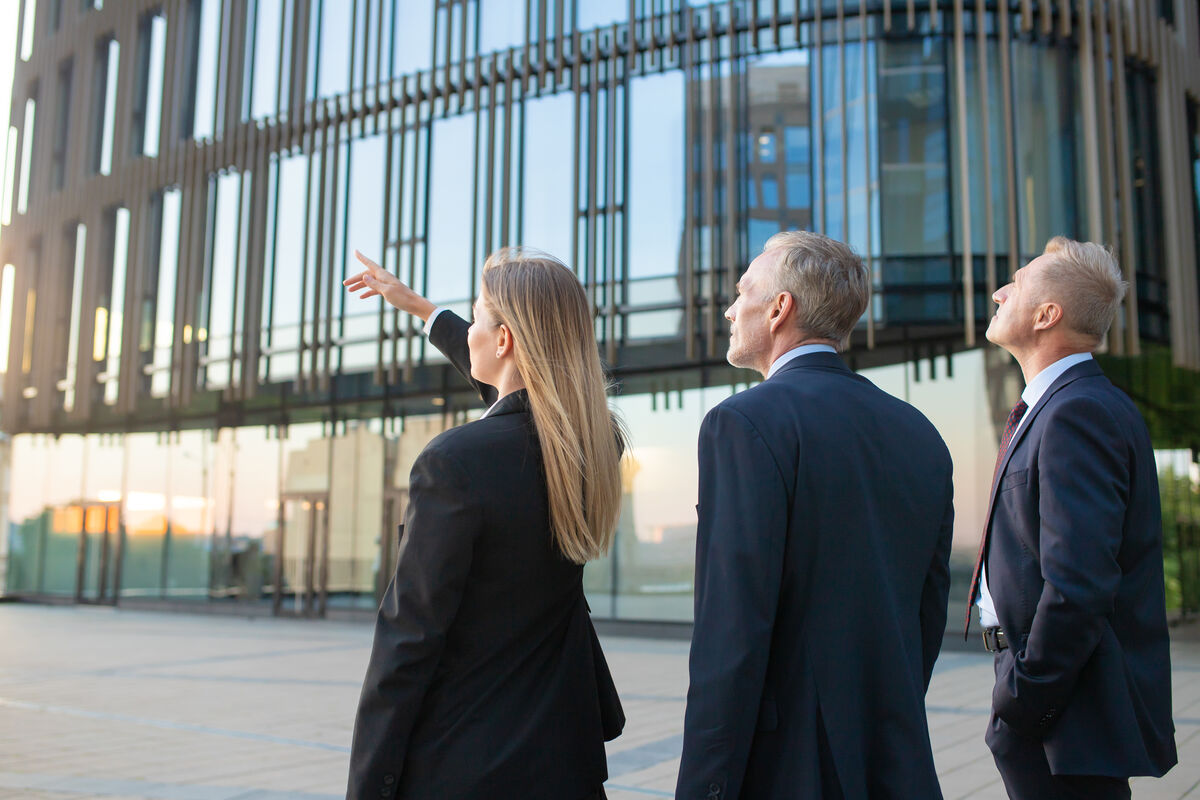 Business professionals discussing property